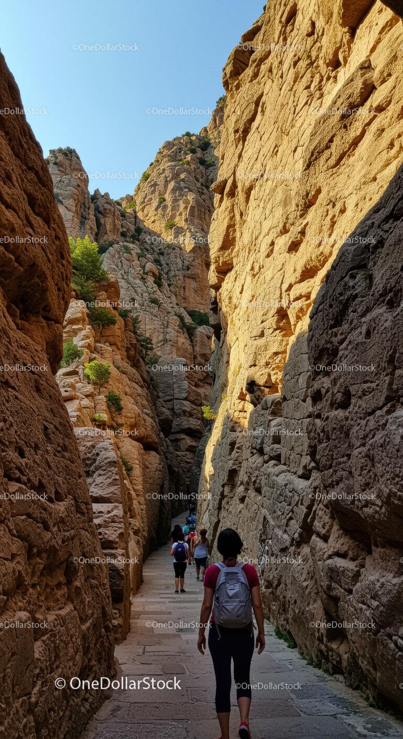 Scenic Mountain Canyon Passage with Rock Formations and Hikers