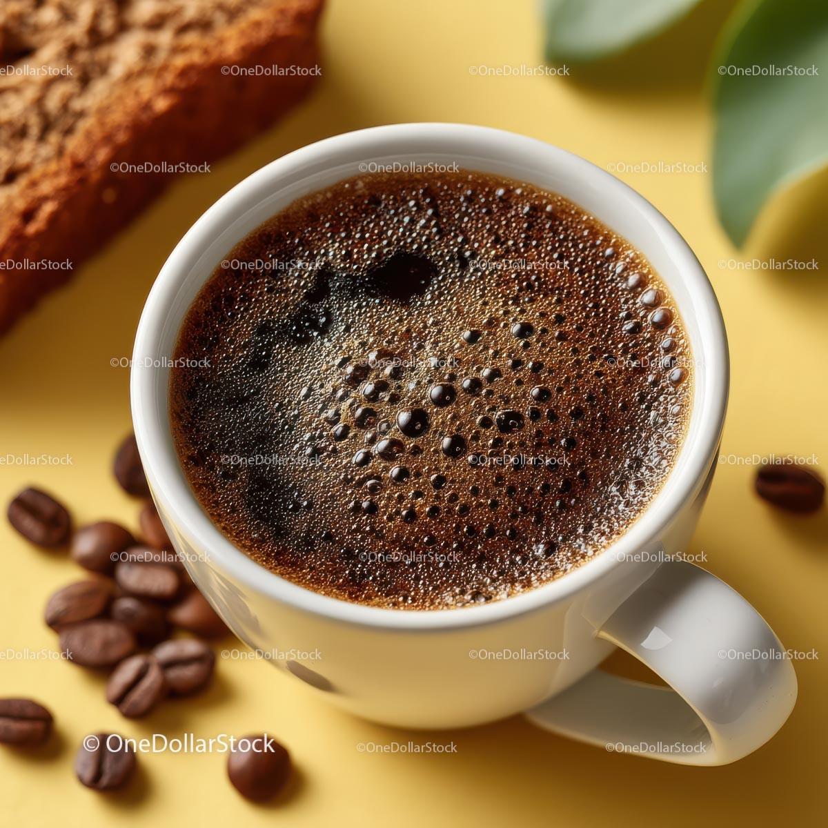 Steaming Black Coffee Cup on Yellow Background with Beans