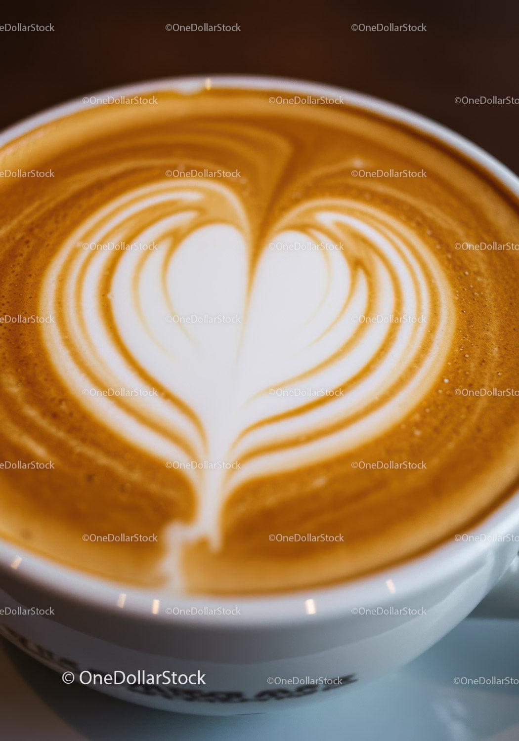 Close up of heart shaped latte art coffee cup