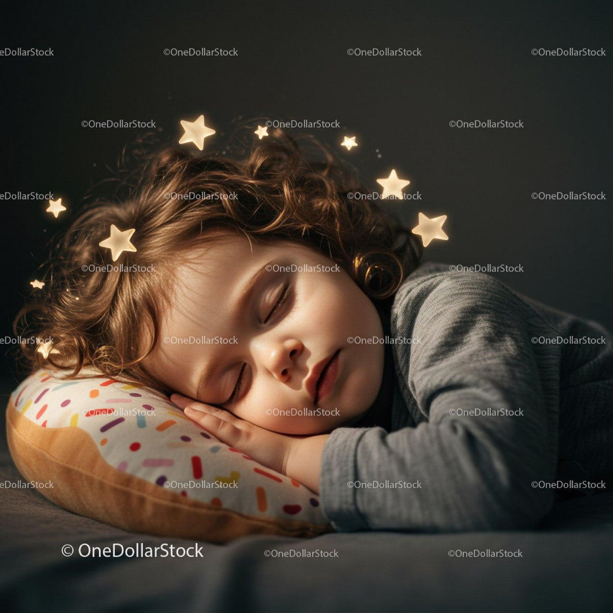 Peaceful child sleeping on soft donut pillow with stars