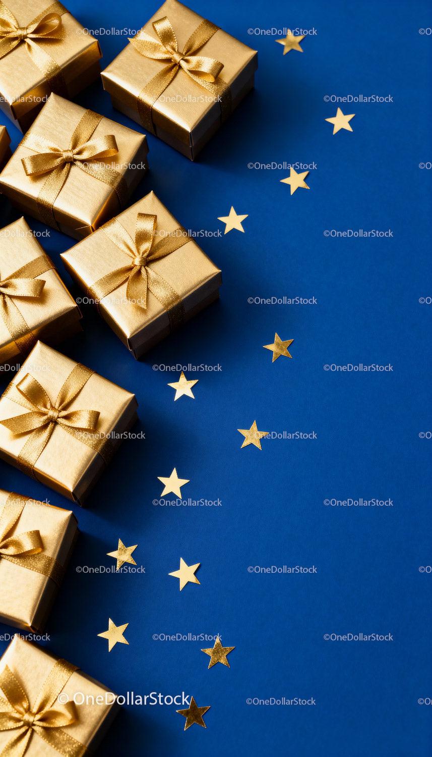 Elegant Gold Gift Boxes with Star Decorations on Blue