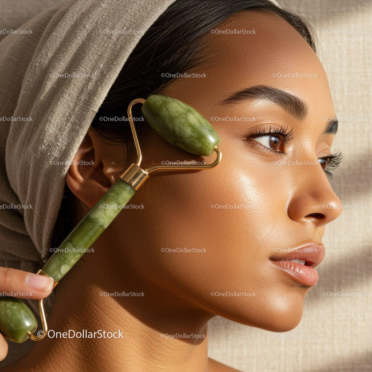 Close-up of a Woman Using a Jade Roller for Facial Skincare
