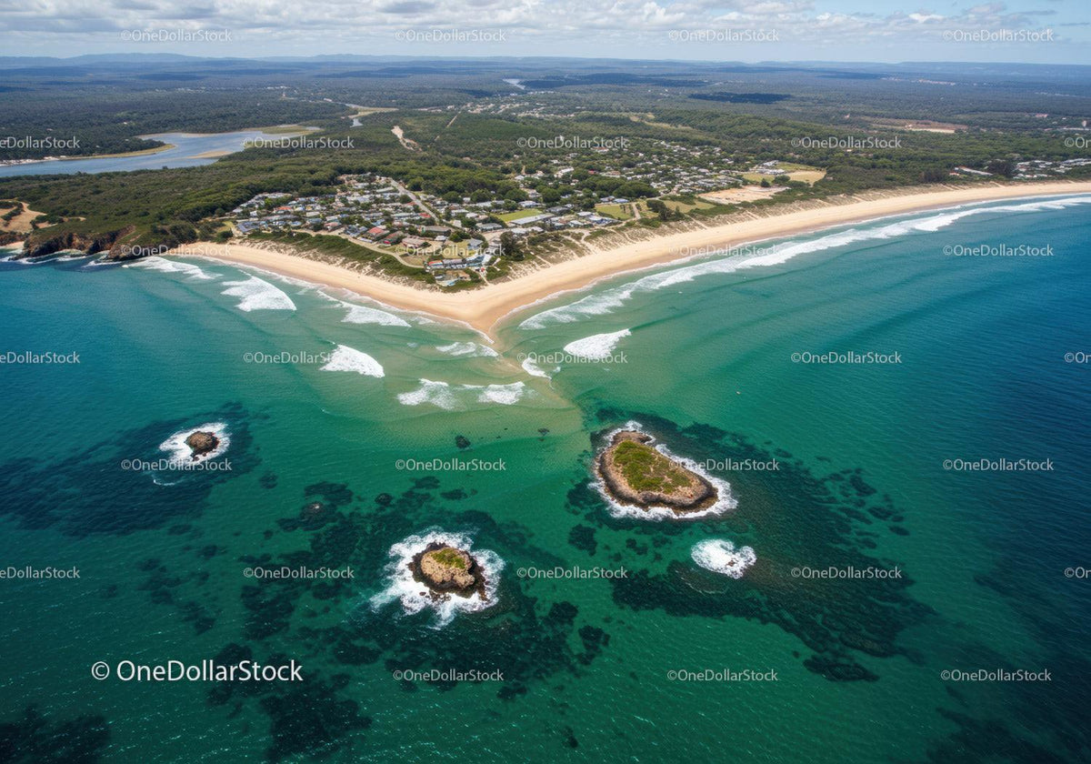 Scenic Aerial View of Turquoise Ocean and Sandy Beach with Rocks and Islands