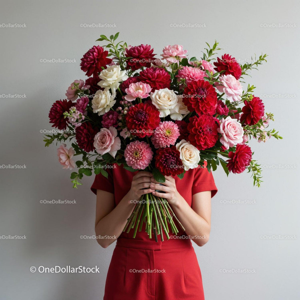 Person Holding Large Bouquet of Red and Pink Flowers