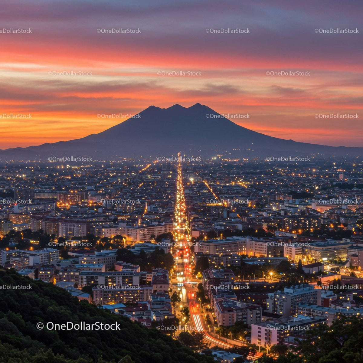 Sunset Over Mountain and Cityscape with Vibrant Sky and Lights
