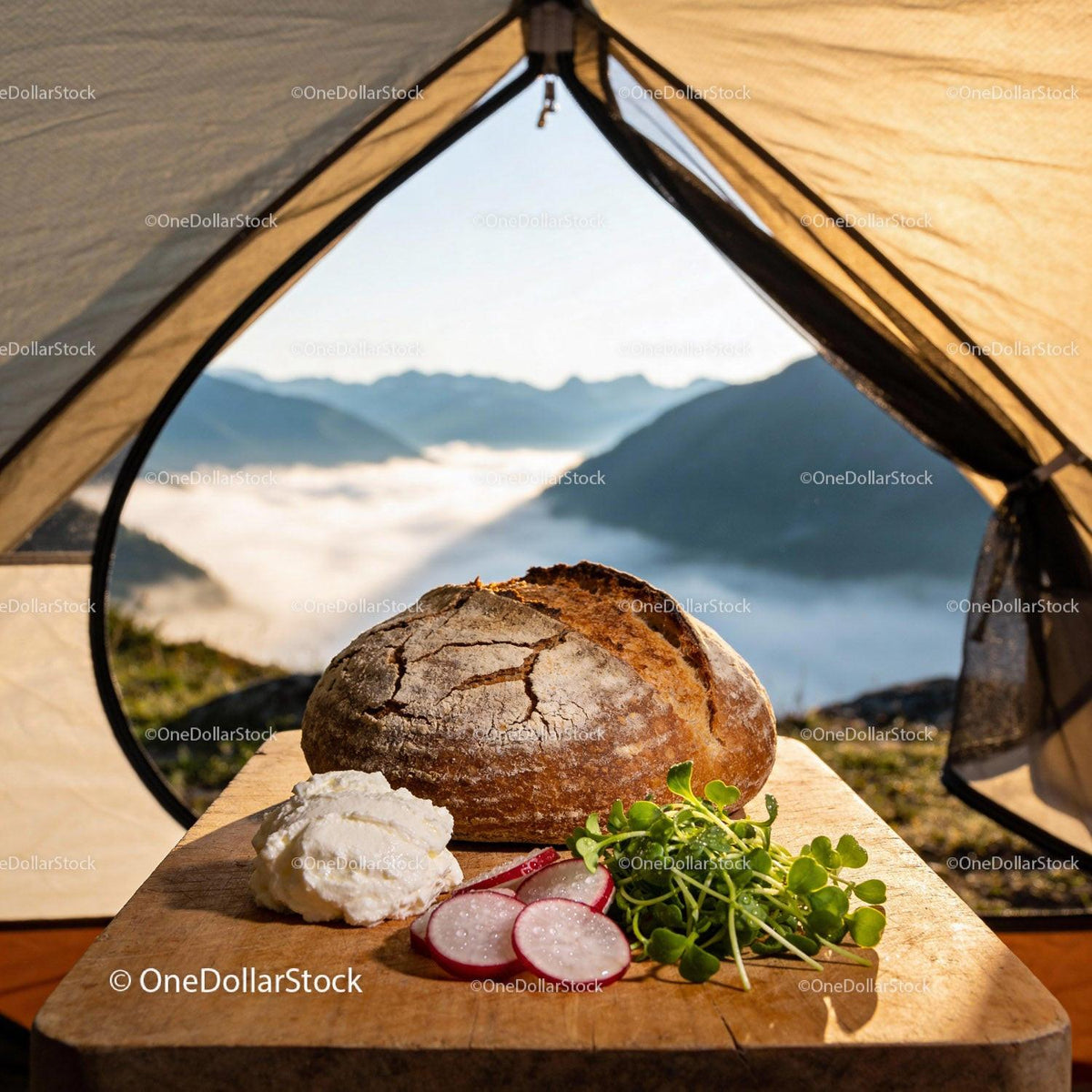 Fresh rustic bread with cream and herbs in mountain tent