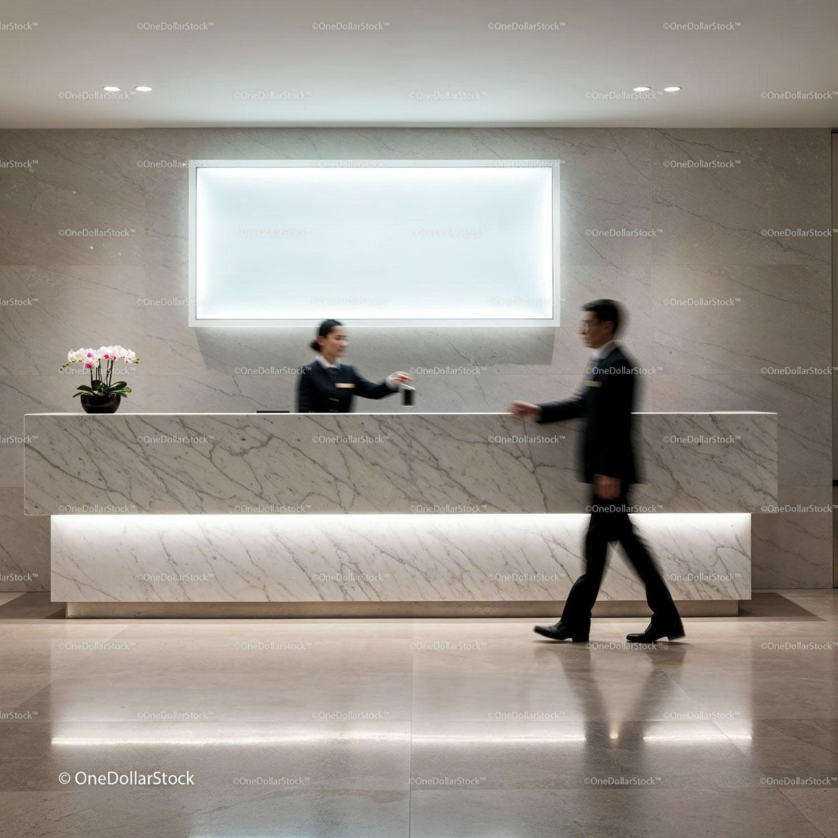 Hotel receptionist handing key card to guest at marble desk JPG Mockup Image preview