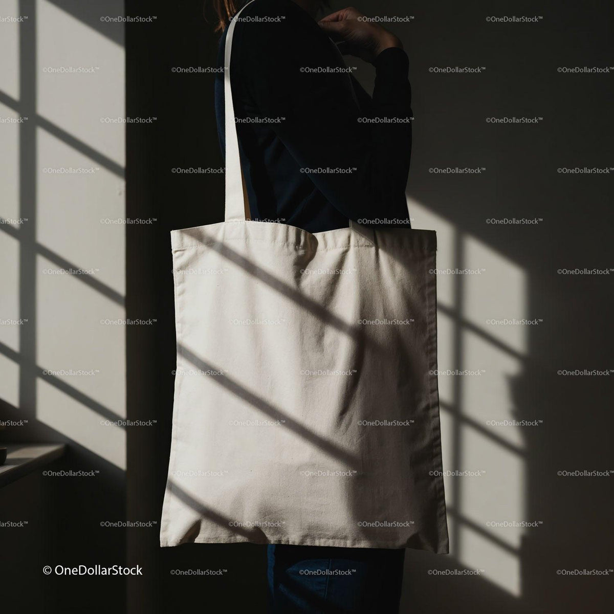 Person Carrying Plain Beige Canvas Tote Bag Indoors JPG Mockup Image preview