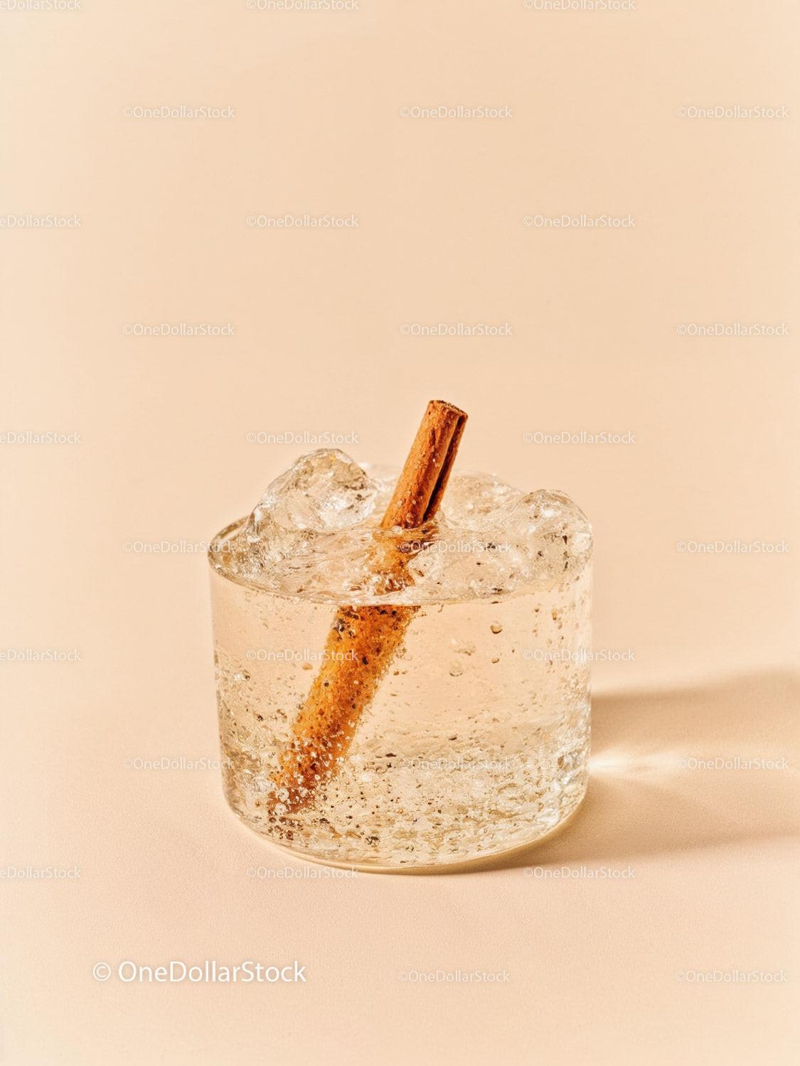 Refreshing Sparkling Drink with Cinnamon Stick on Beige
