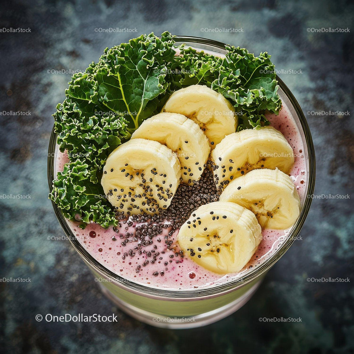 Banana Slices and Kale in a Nutritious Berry Smoothie Glass