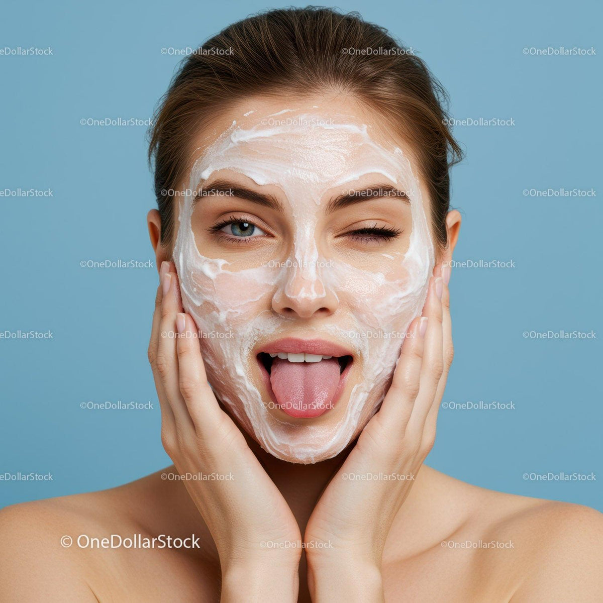 Young Woman Wearing Cream Facial Mask and Smiling Brightly