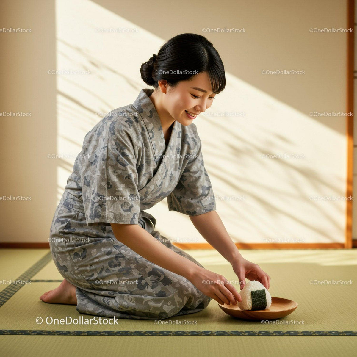 Smiling woman in traditional attire placing rice ball on plate