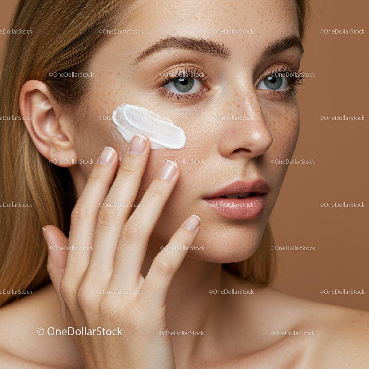 Close-up of Woman Applying Sunscreen to Face for Skin Protection