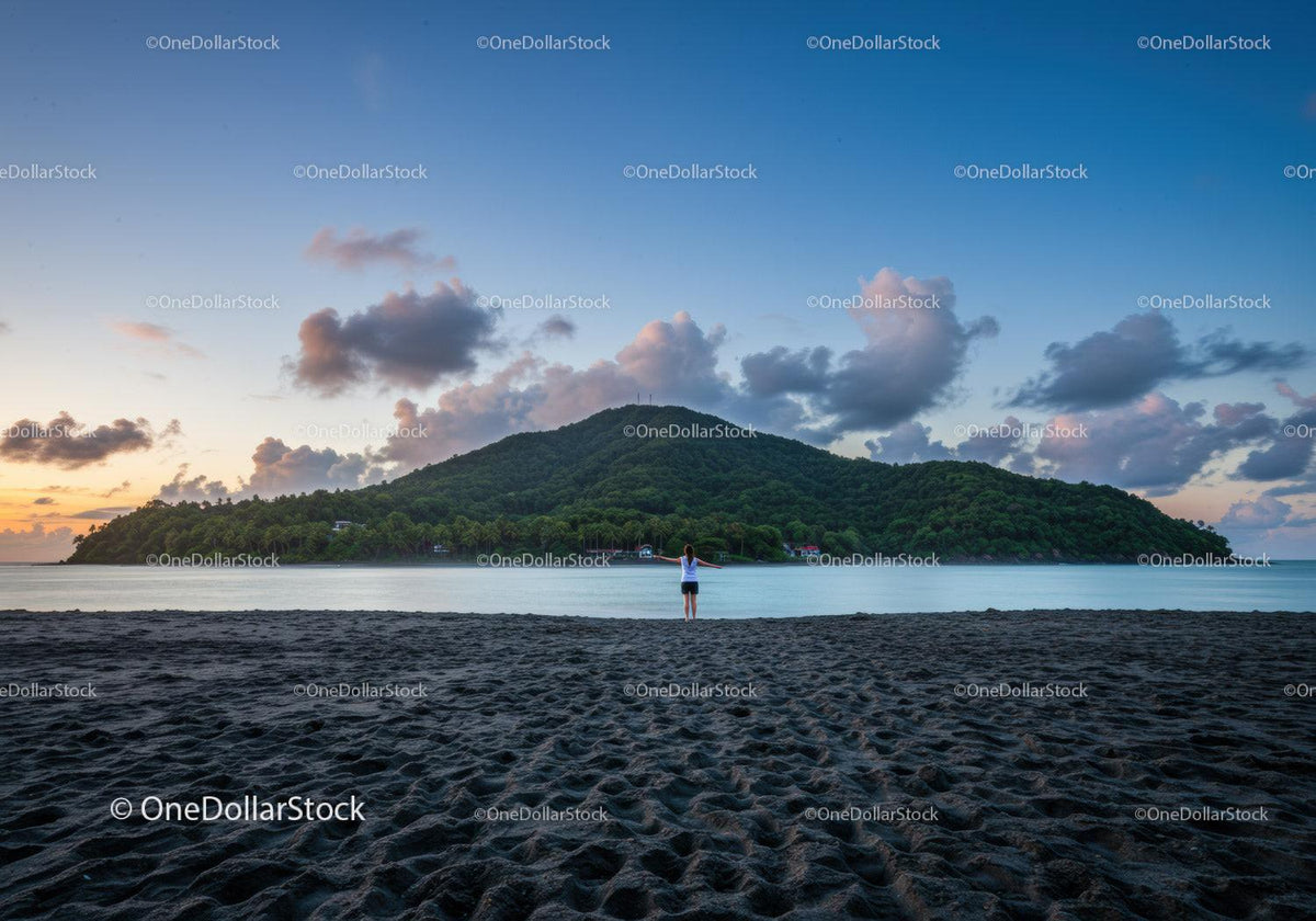 Scenic Mountain Island Over Calm Beach at Sunset