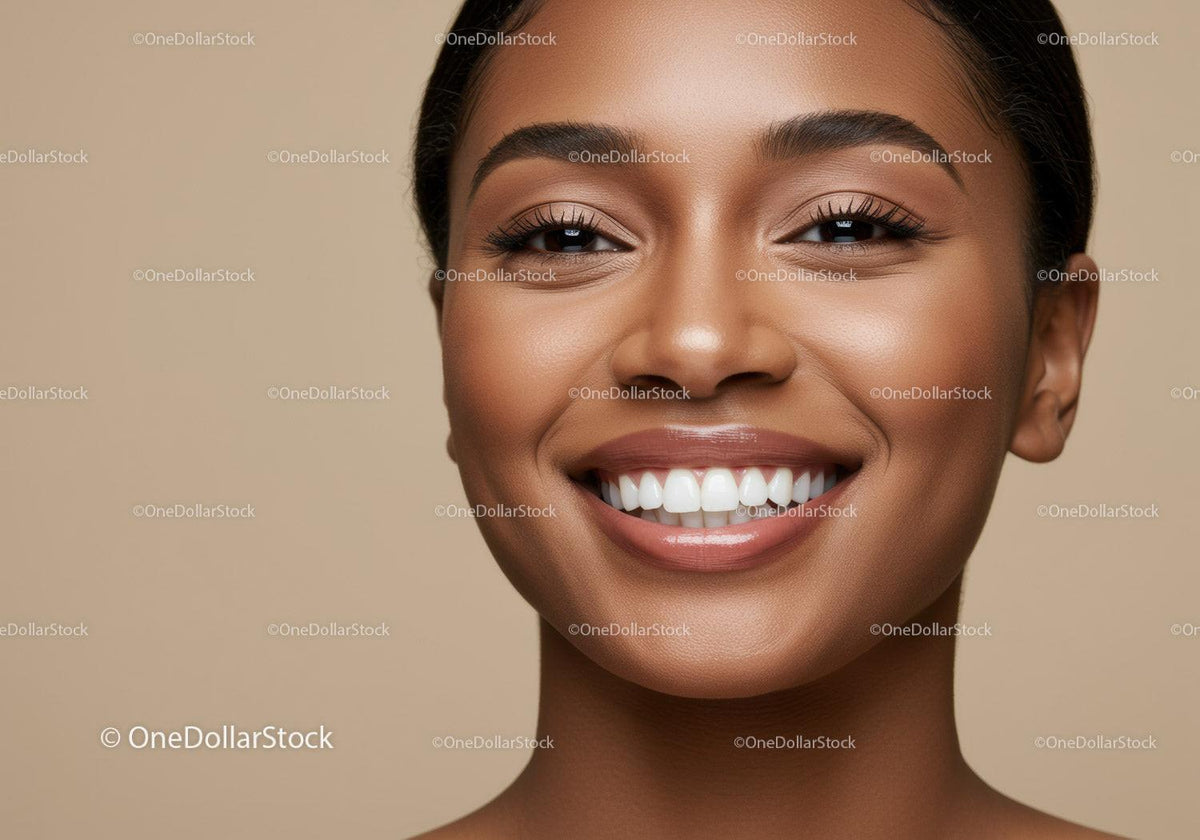 Closeup of smiling young woman with glowing skin