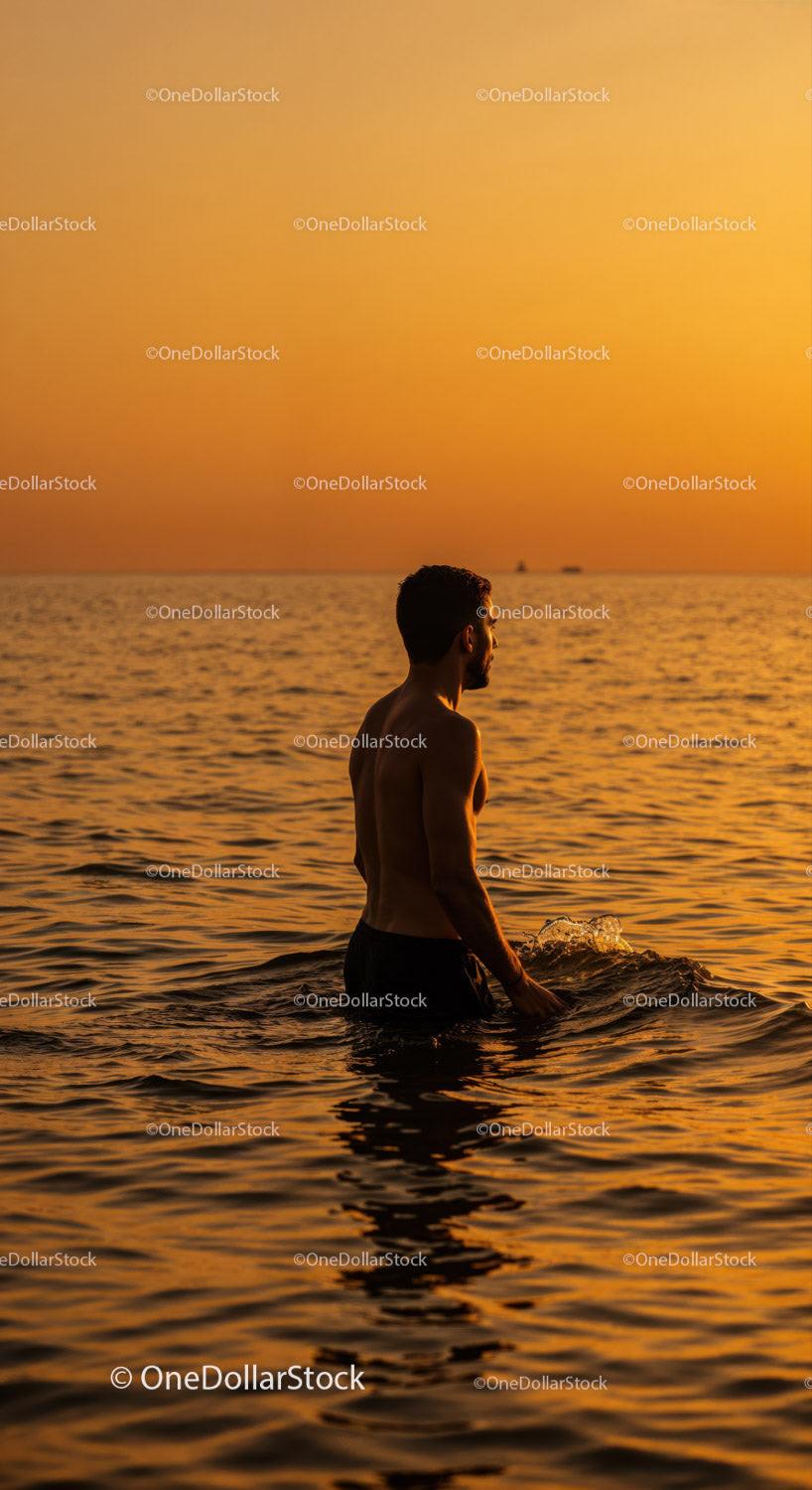 Serene Man Swimming in Ocean During Vibrant Sunset Stock Photo Bundle creative preview 4