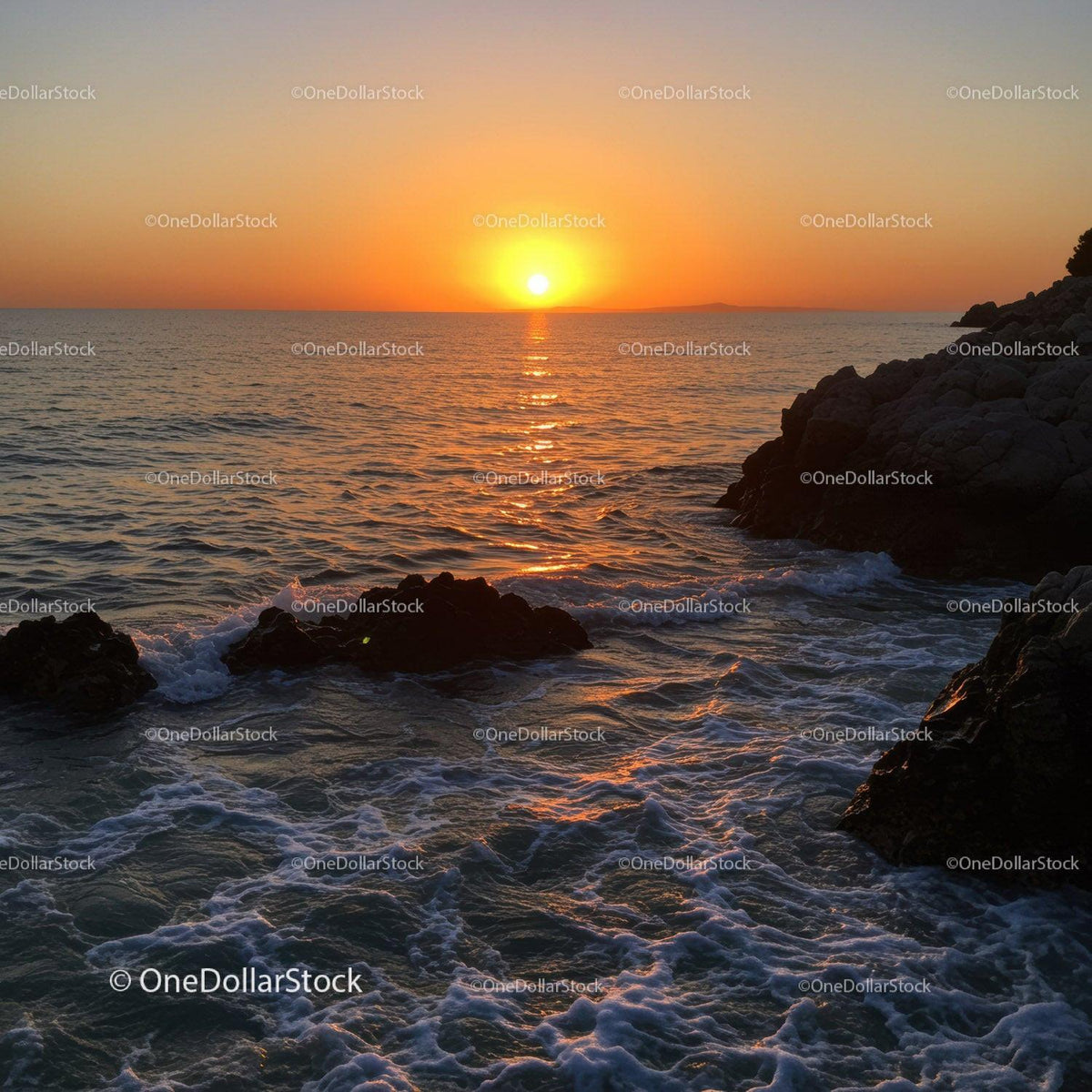 Beautiful Sunset Over Rocky Coastline with Calm Ocean Waves