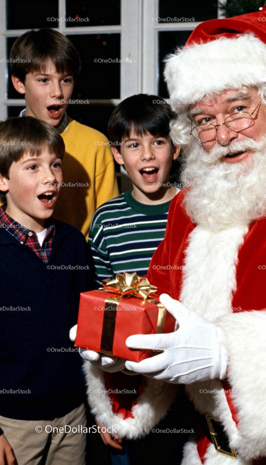 Children excitedly receiving a gift from Santa Claus indoors