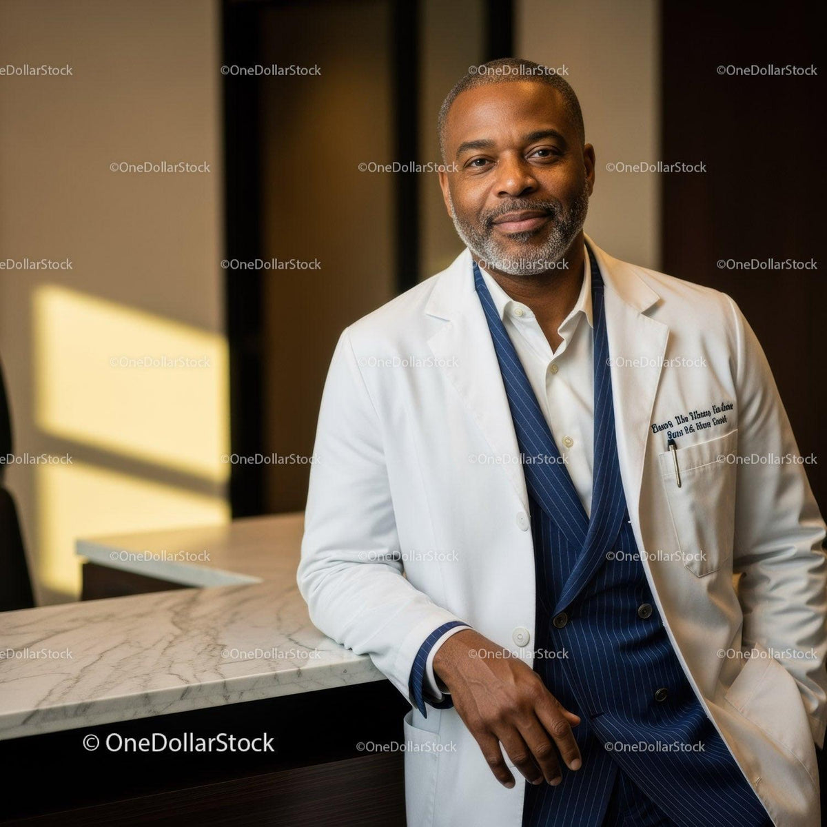 Senior African American Male Doctor Wearing White Lab Coat and Blue Suit in Clinic