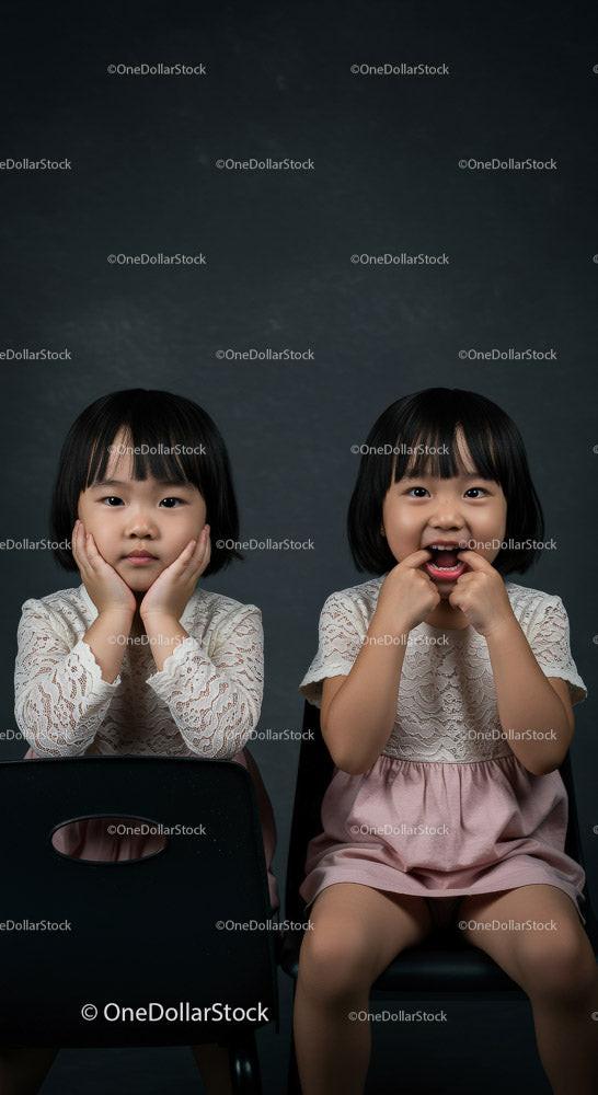 Two Happy Girls with Joyful Expressions Sitting Together Stock Photo Bundle preview 12
