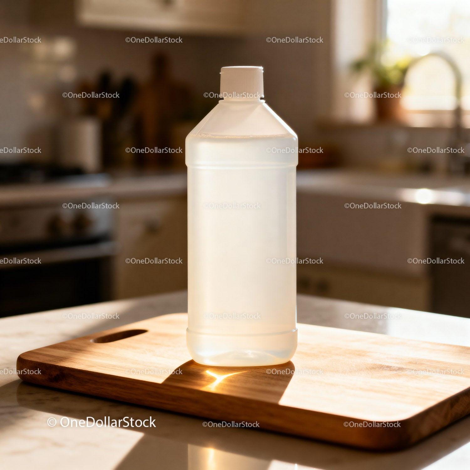 Clear plastic bottle on wooden cutting board in kitchen