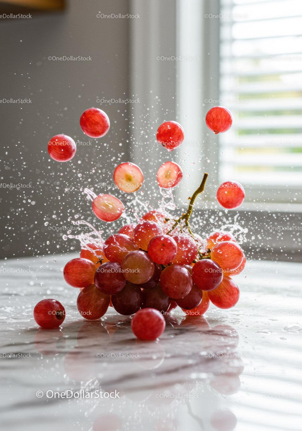 Fresh red grapes bursting with dynamic water splash