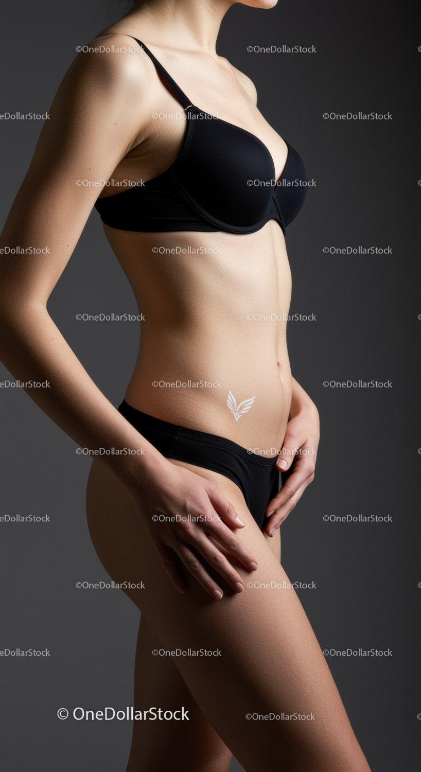 Elegant Woman in Black Lingerie with Smooth Skin and Artistic Lighting