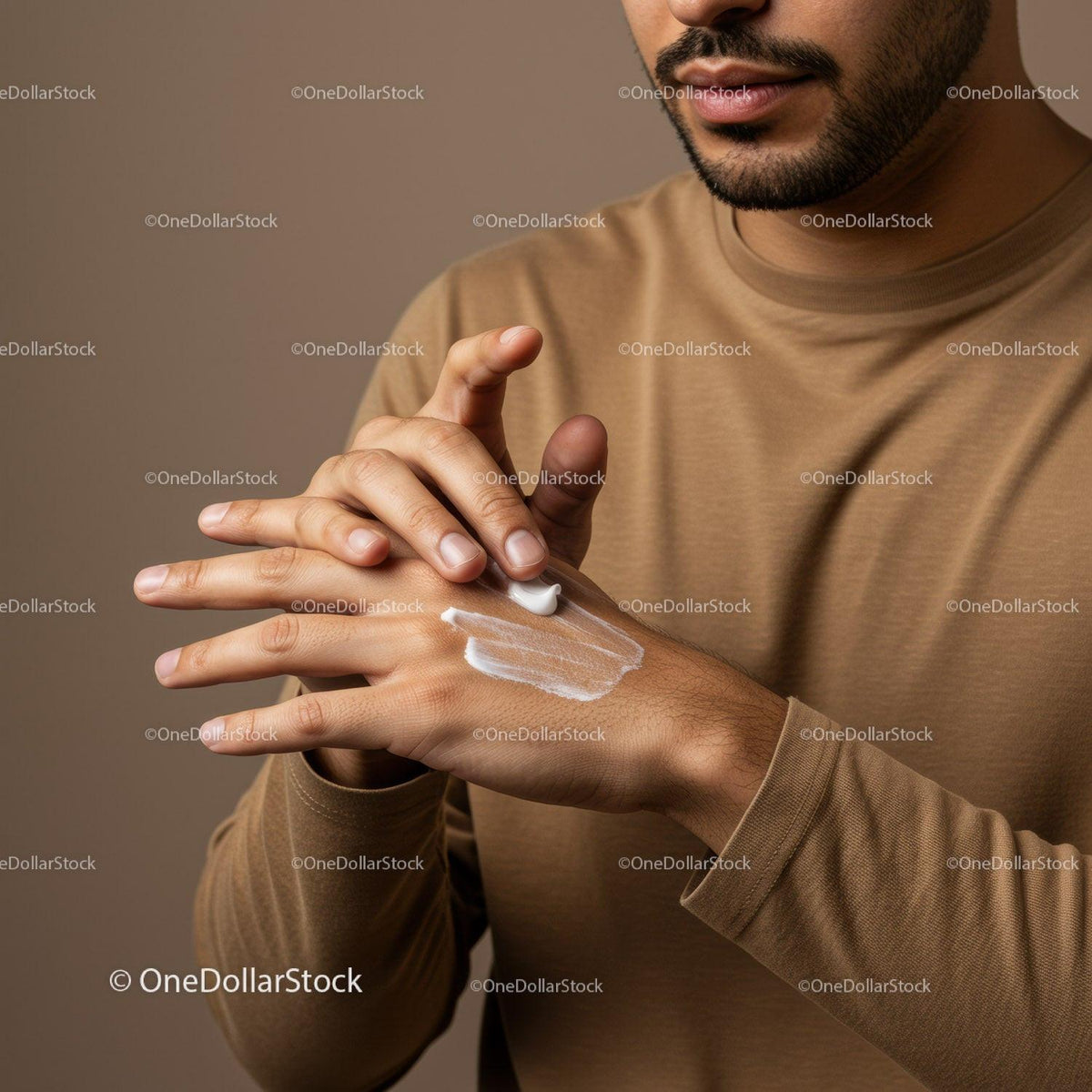 Man Applying Lotion on Hand for Moisturizing Skincare Routine