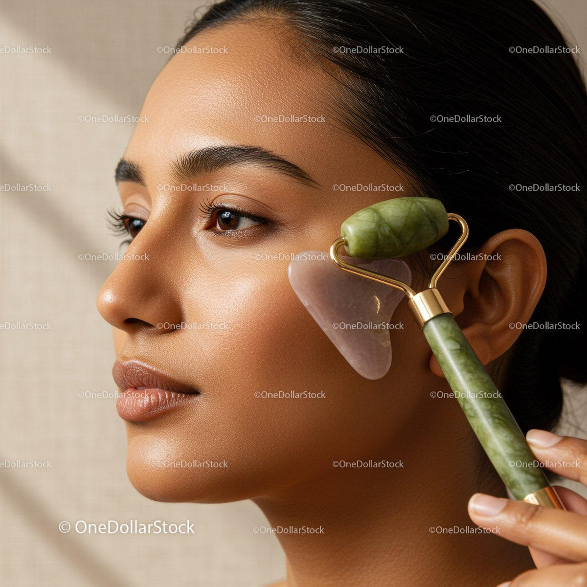 Close-up of Woman Using Jade Roller for Facial Skincare