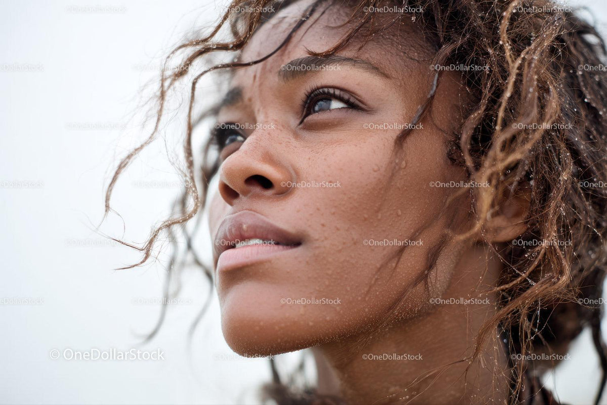 Close-up Portrait of a Woman with Wet Curly Hair and Water Droplets