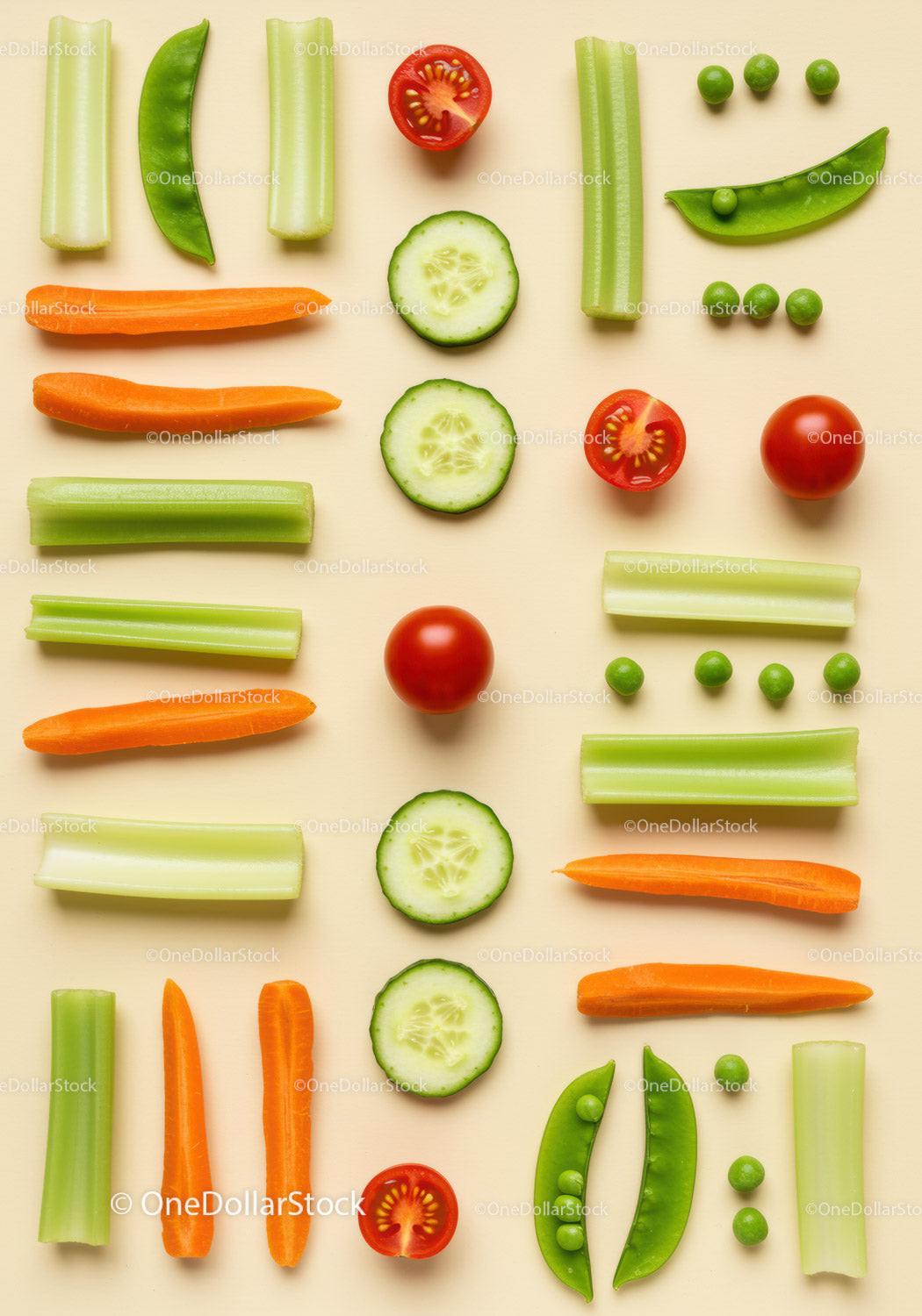 Fresh sliced vegetables arranged on beige surface