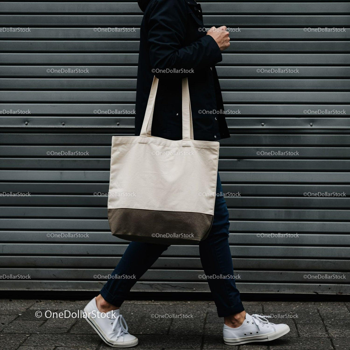 Person Walking with Neutral Canvas Tote Bag by Wall JPG Mockup Image preview