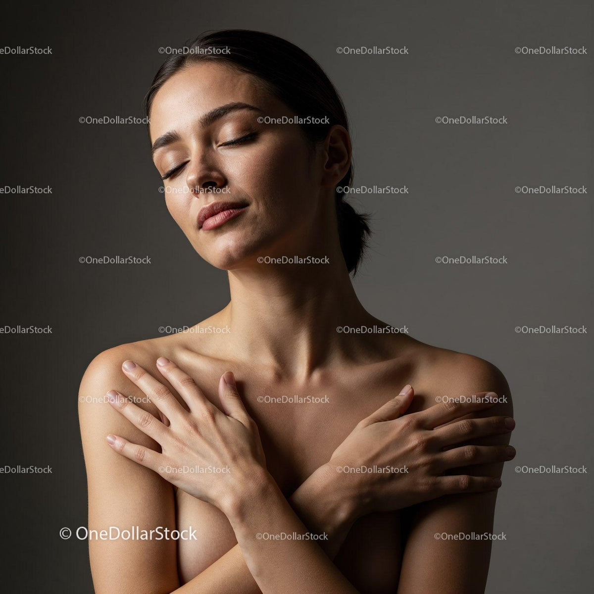 Serene woman embracing herself with closed eyes