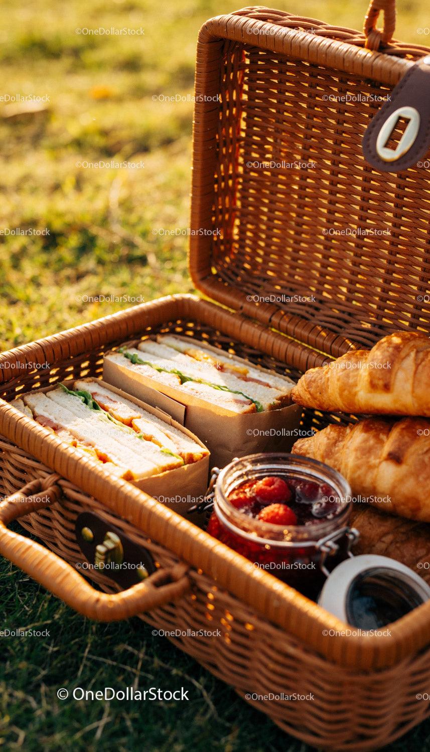 Fresh Picnic Basket with Sandwiches Croissants and Jam