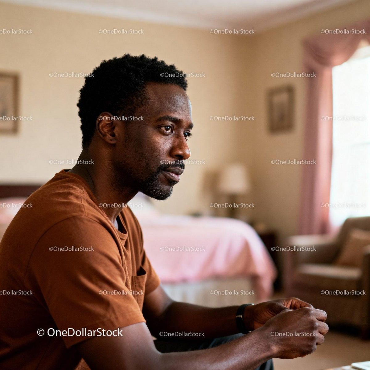 Thoughtful man sitting in cozy softly lit room