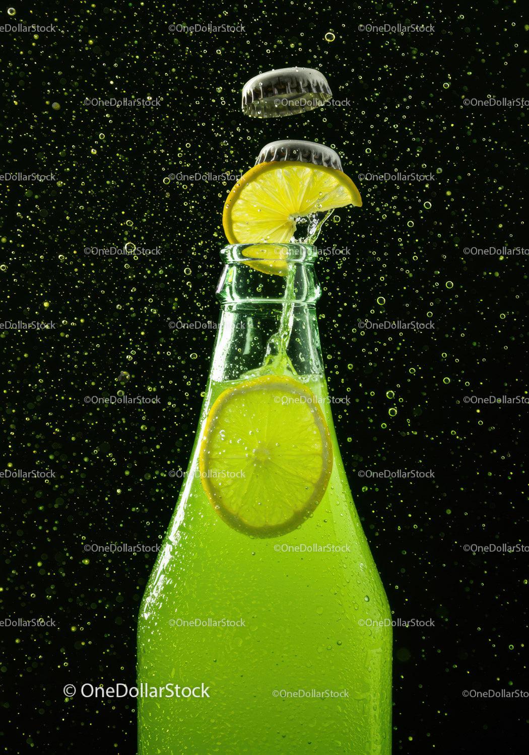 Refreshing lime soda with lemon slice and fizz bubbles