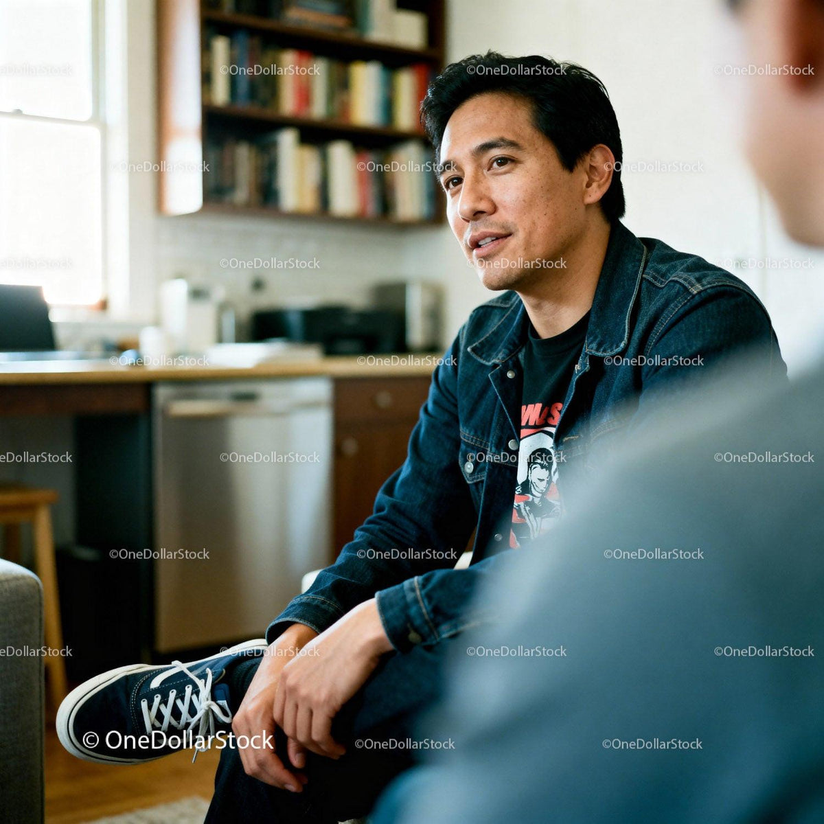 Casual Man Engaged in Conversation at Home
