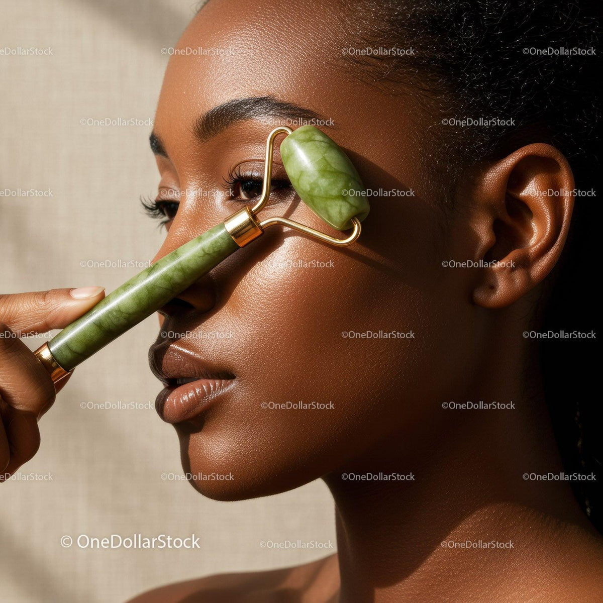 Close-up of Woman Using Jade Roller for Facial Skincare