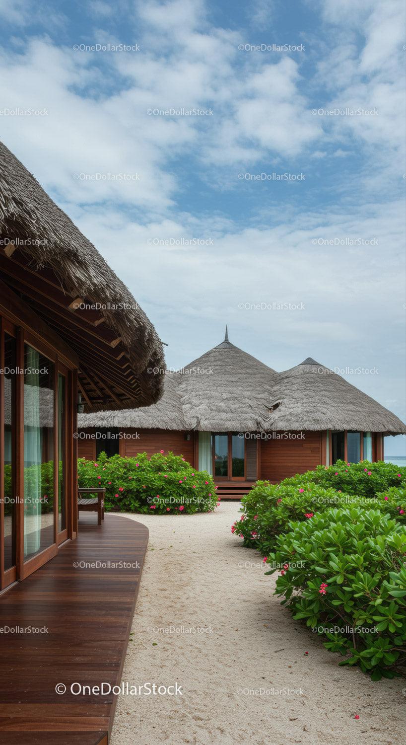 Tropical Beachside Villas with Thatch Roofs and Lush Gardens