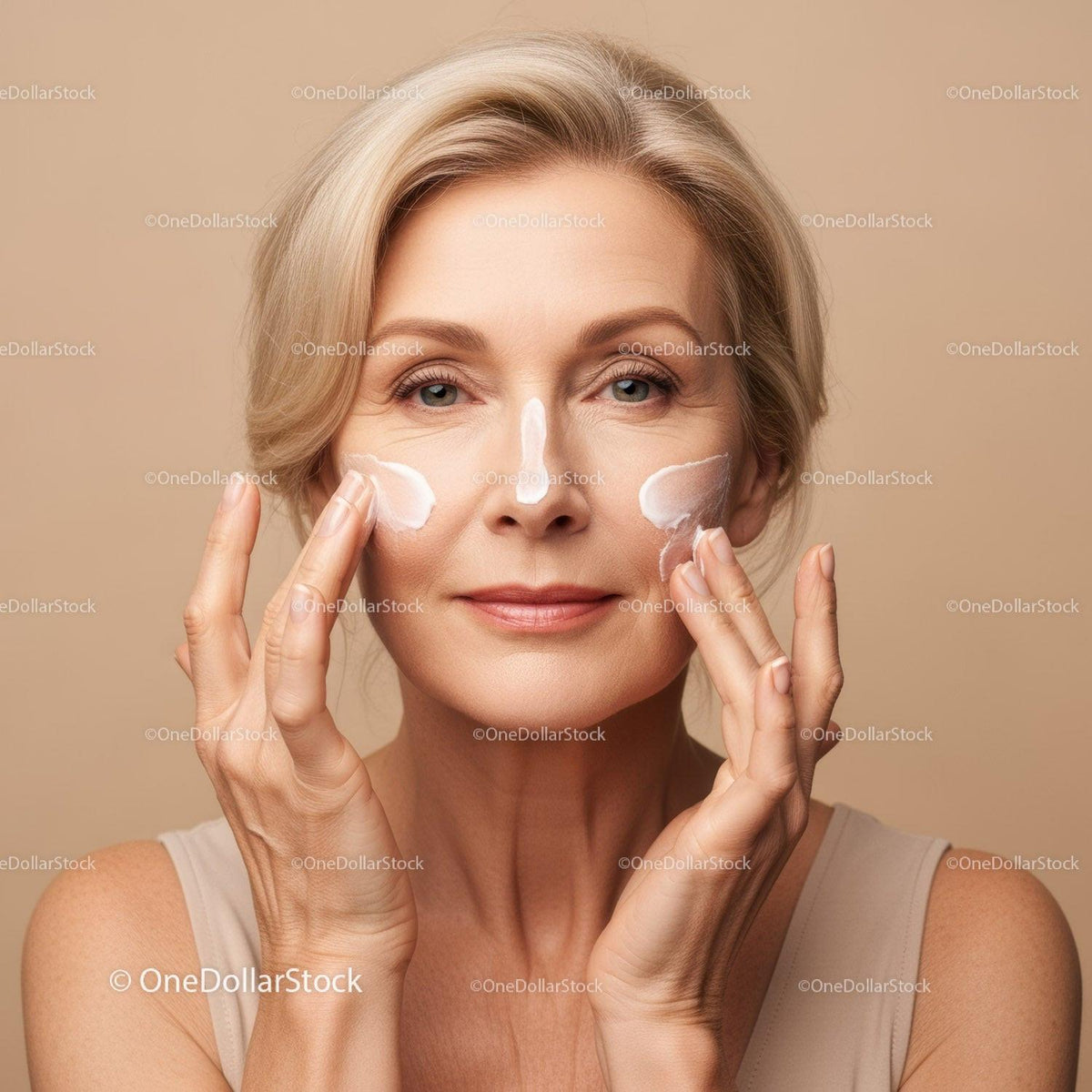 Beautiful Mature Woman Applying Facial Cream for Skincare Routine