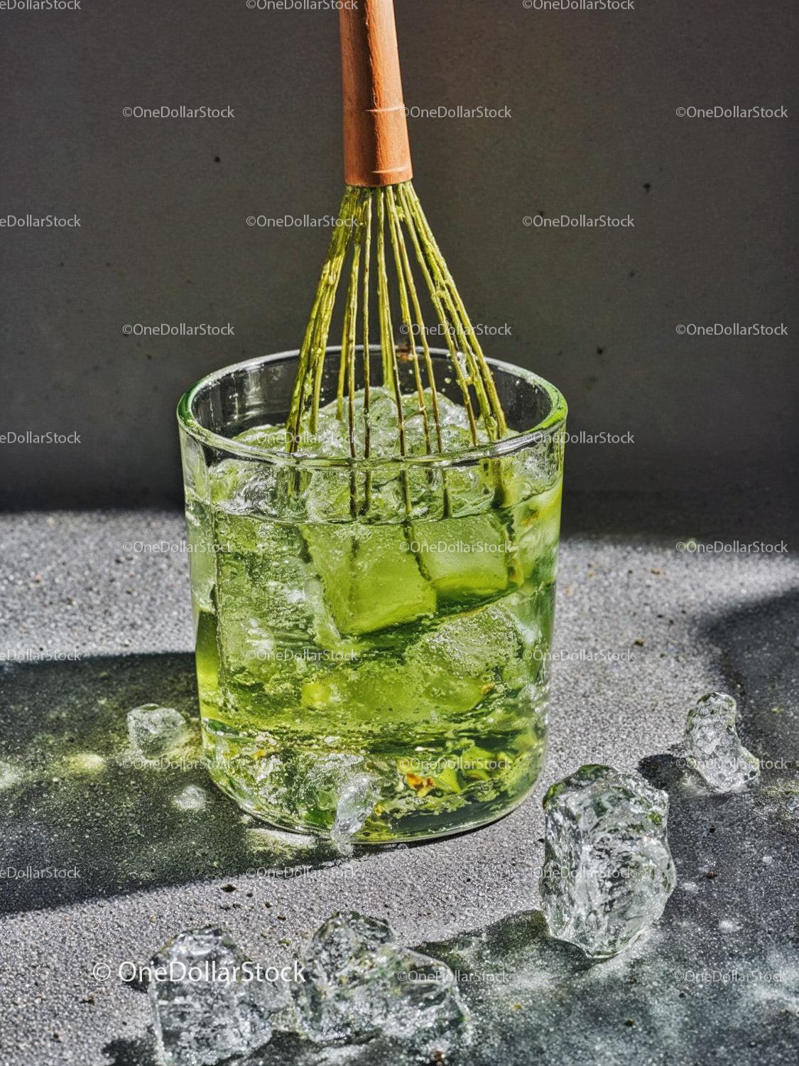 Refreshing green matcha tea with ice cubes in glass