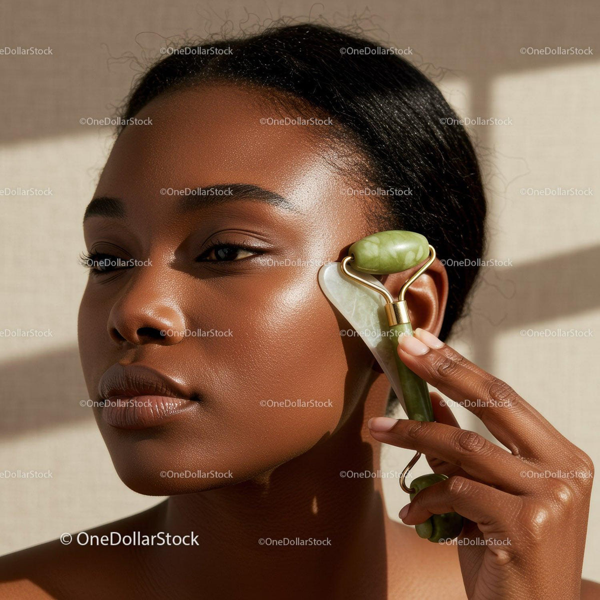 Close-up of a Woman Using a Jade Roller for Facial Skincare