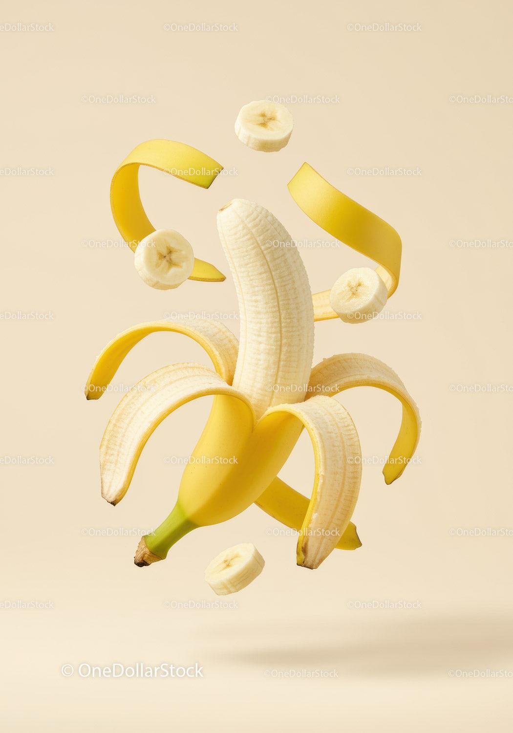 Peeled banana with floating slices and peel spirals