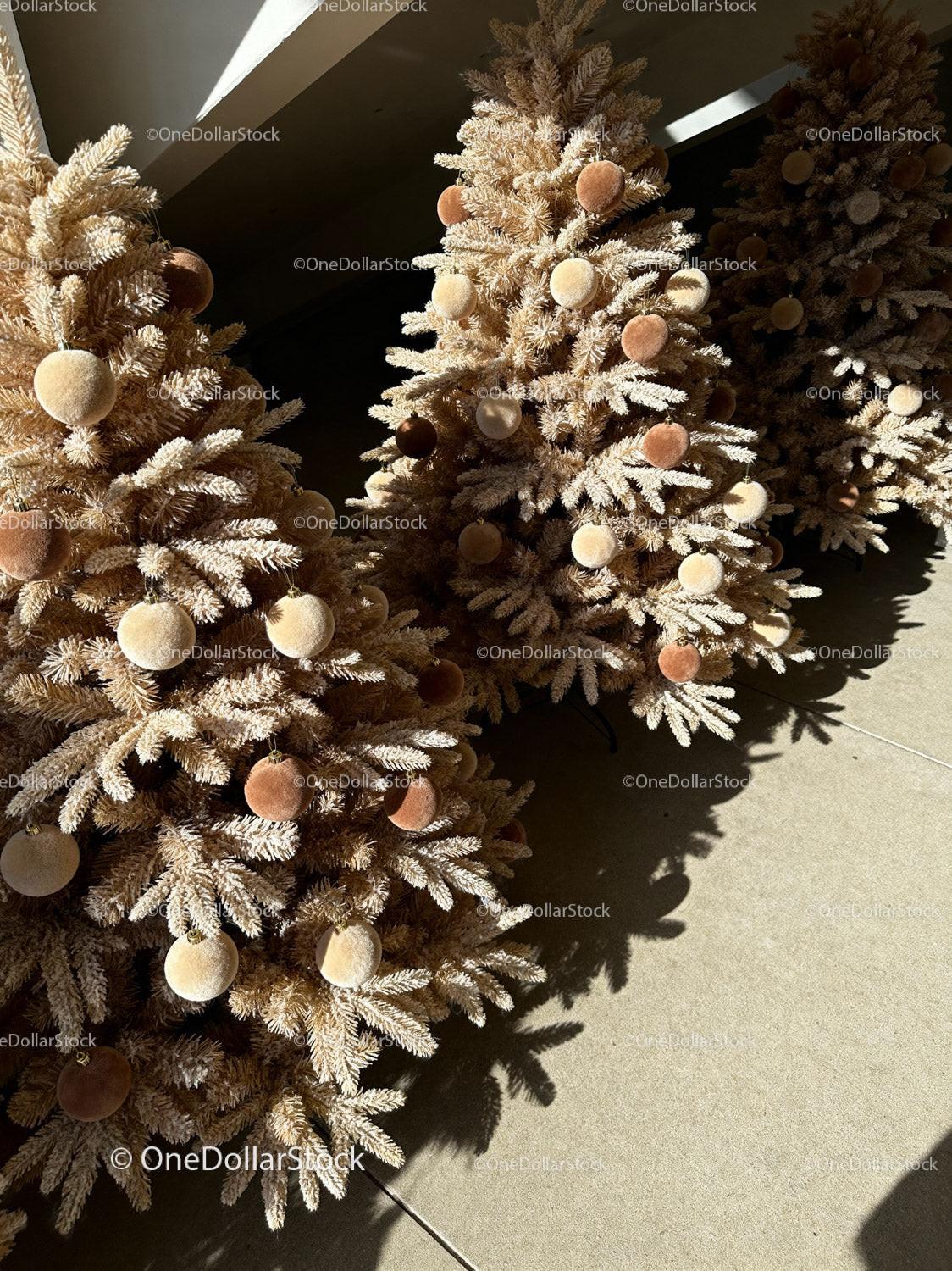 Decorated beige Christmas trees with plush ornaments