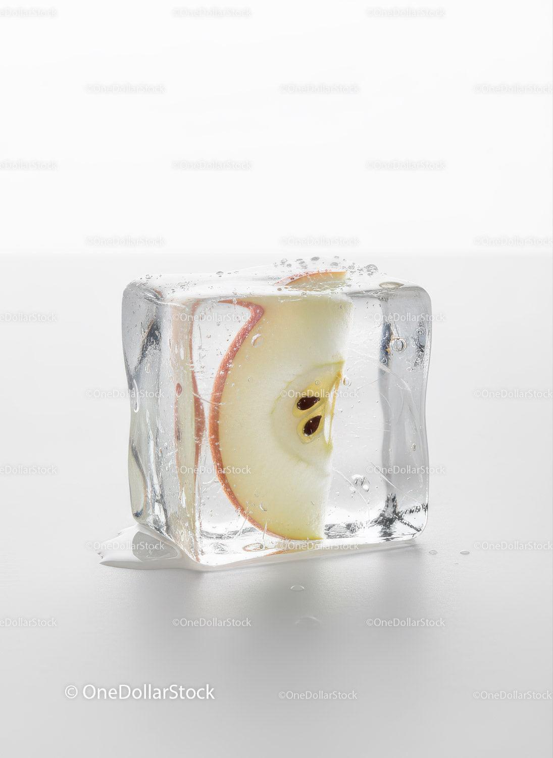 Fresh Apple Slice Captured Inside Melting Ice Cube