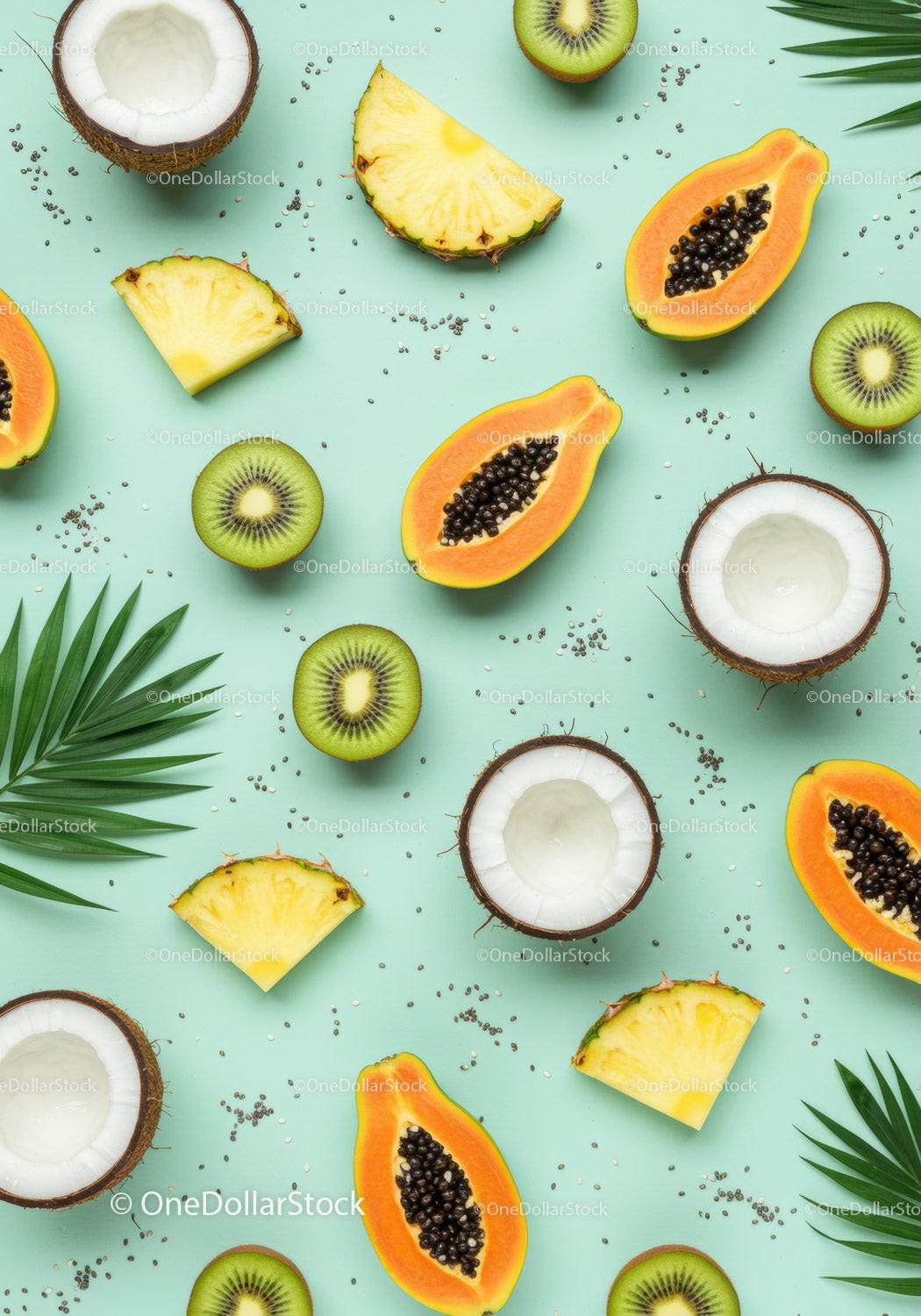 Fresh tropical fruits with coconut and palm leaves