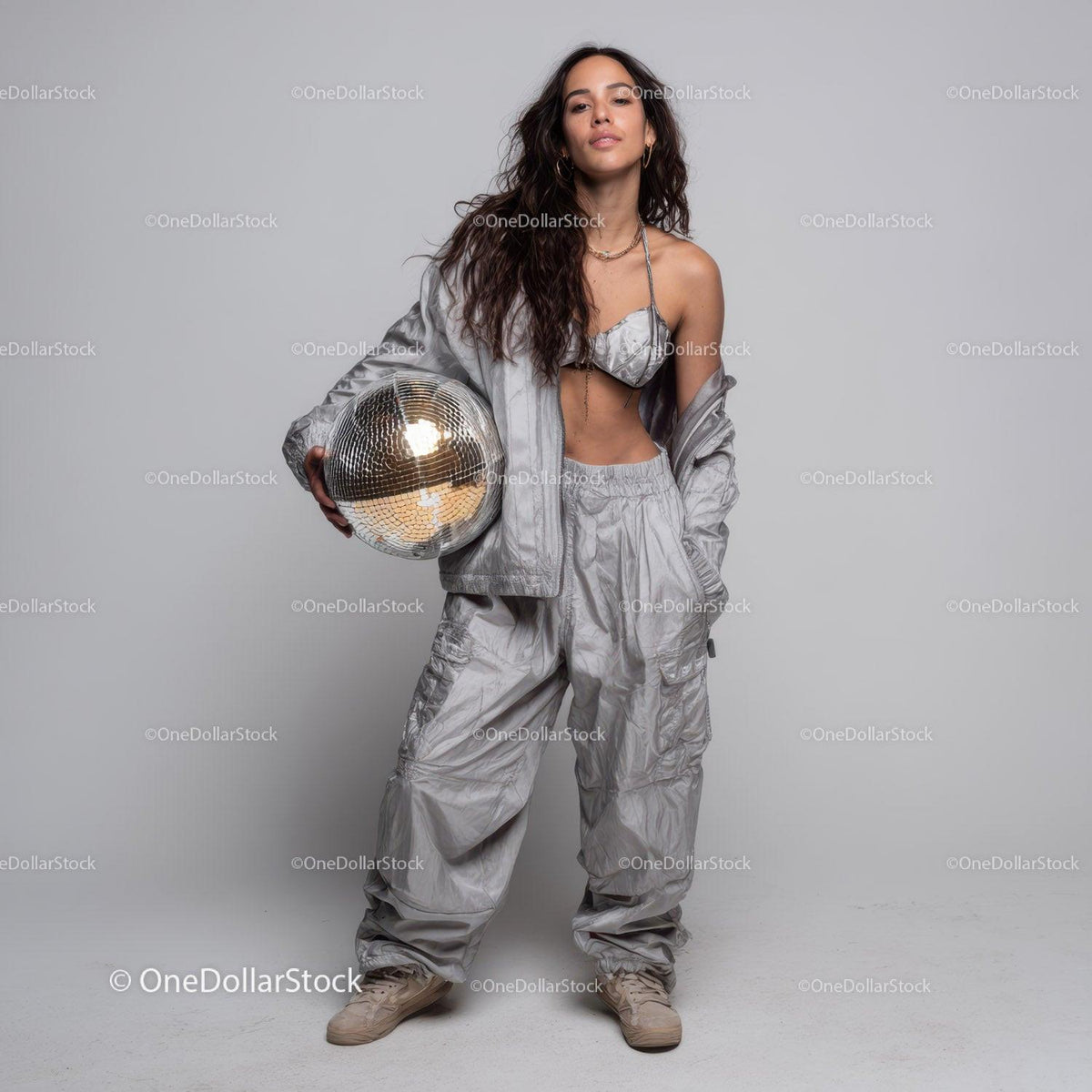 Stylish Woman in Metallic Outfit Holding Disco Ball for Modern Fashion Stock Photo Bundle preview 21