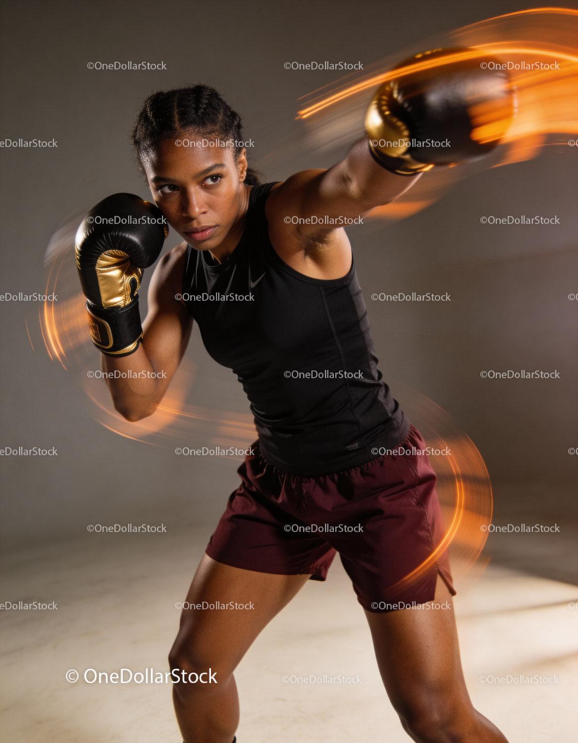 Focused female boxer delivering a powerful punch