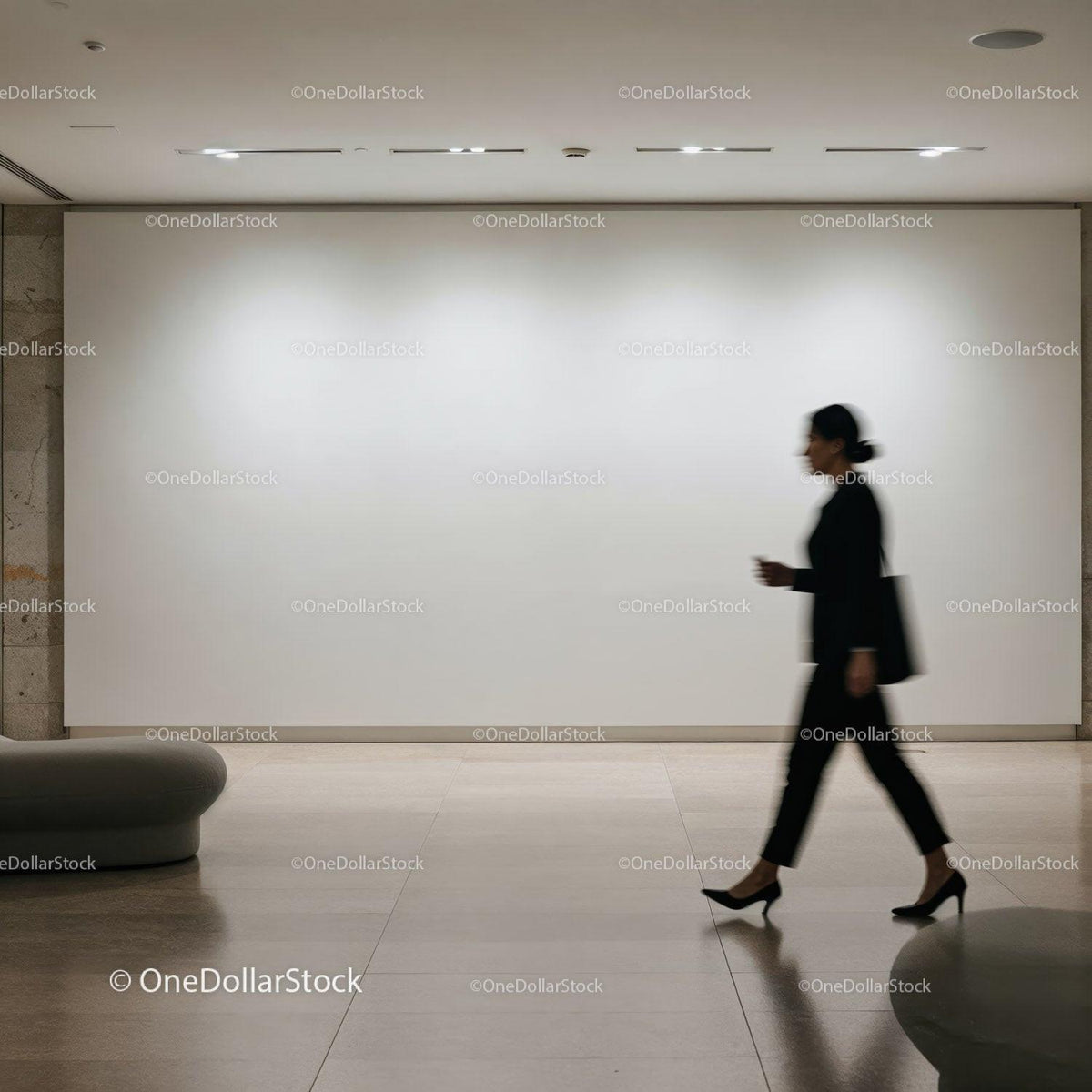 Businesswoman walking past blank gallery wall JPG Mockup Image preview