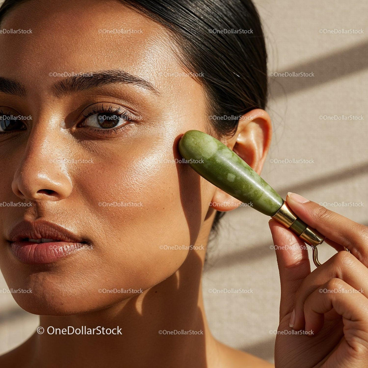 Close-Up of Woman Using Jade Roller for Facial Skincare